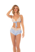 Two-piece pajama set featuring a lace triangle top with front tie detail and matching flutter shorts.