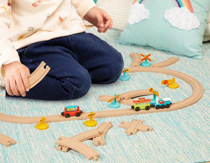 Toy train set with tracks and colorful trains and accessories