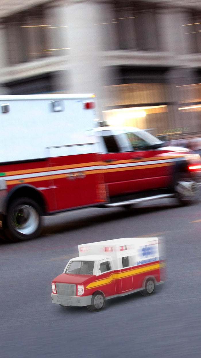 Toy ambulance with stretcher.