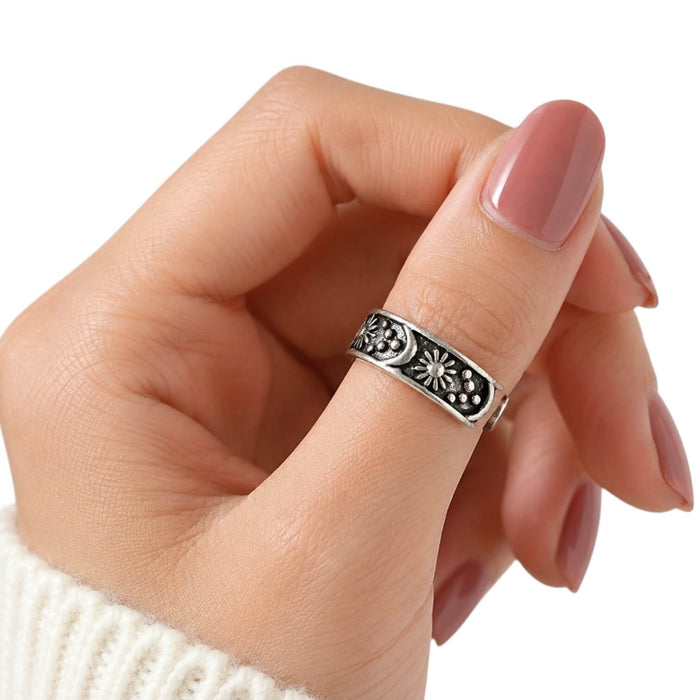 woman wearing as thumb ring Cosmic Open Band Ring with silver sun, moon, star, and beaded celestial details
