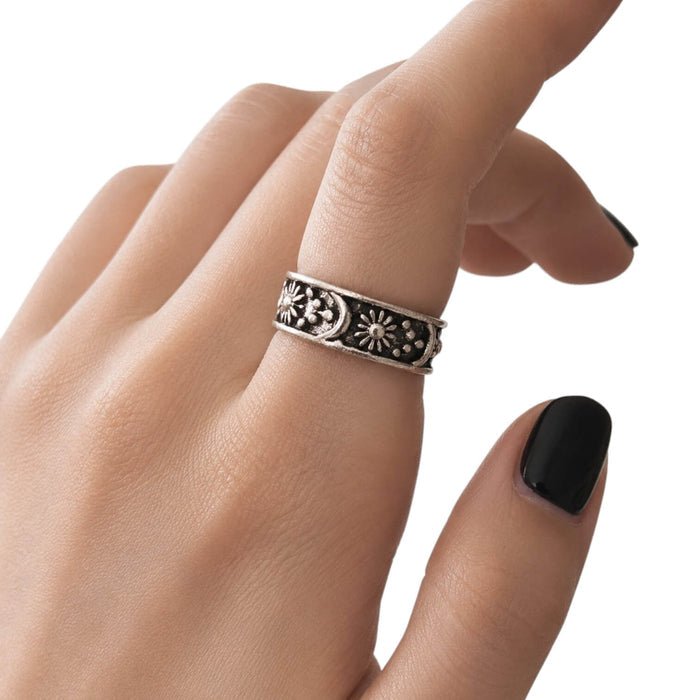 woman wearing as index Cosmic Open Band Ring with silver sun, moon, star, and beaded celestial details