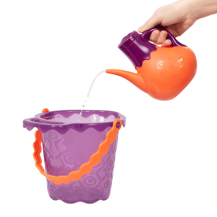 Beach toys with purple bucket.