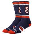 Pair of navy blue socks with red and white stripes on a white background