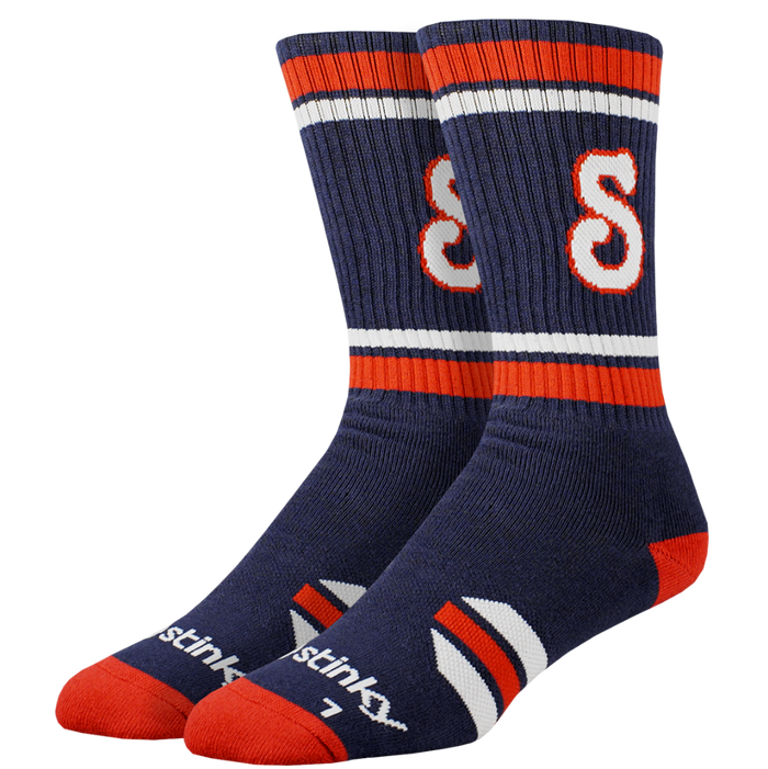 Pair of navy blue socks with red and white stripes on a white background