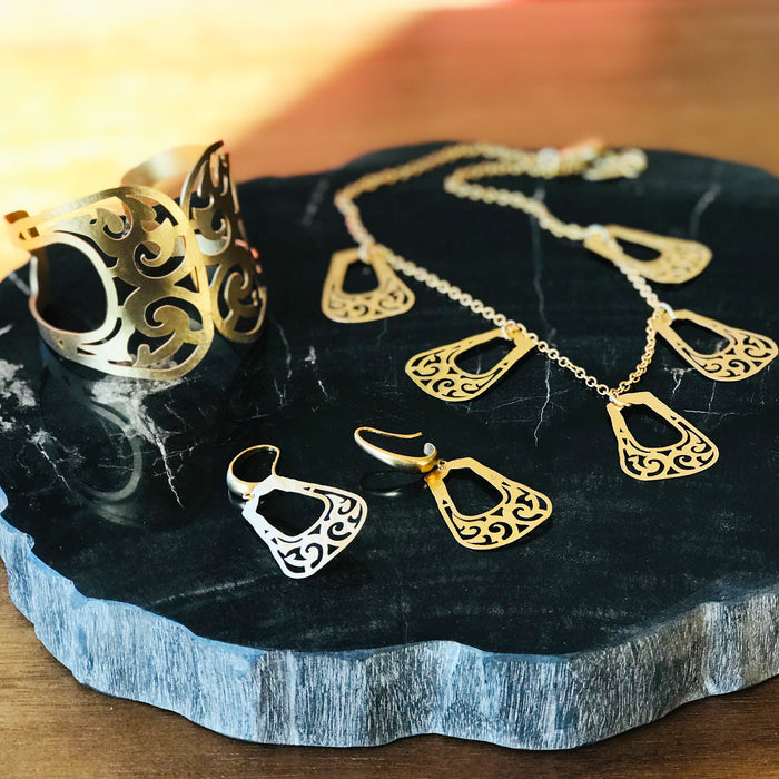 Collection of Bactrian jewelry on a stone surface