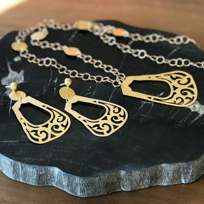 Collection of gold Bactrian Jewelry on a stone surface