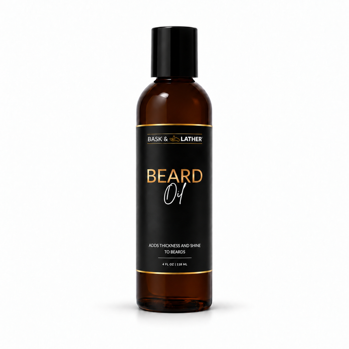 A 4 fl oz amber glass bottle of Bask & Bother Beard Oil with a black cap and black label featuring gold and white text, set against a plain white background.