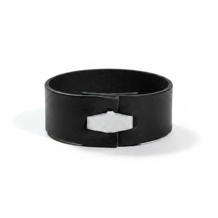 Black leather band rings set with silver geometric hardware and five assorted stackable ring sizes