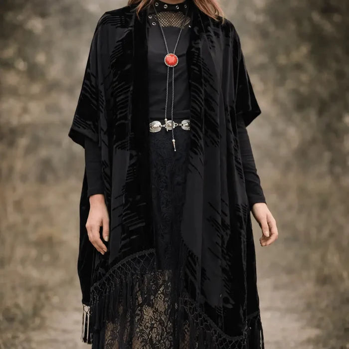 Black long fringe velvet duster jacket with wavy burnout texture, open-front kimono style, relaxed sleeves, and tassel hem for boho western festival layering regular-plus size