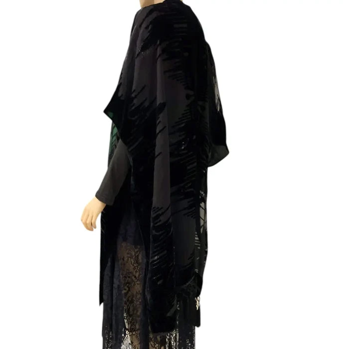 Black long fringe velvet duster jacket with wavy burnout texture, open-front kimono style, relaxed sleeves, and tassel hem for boho western festival layering regular-plus size