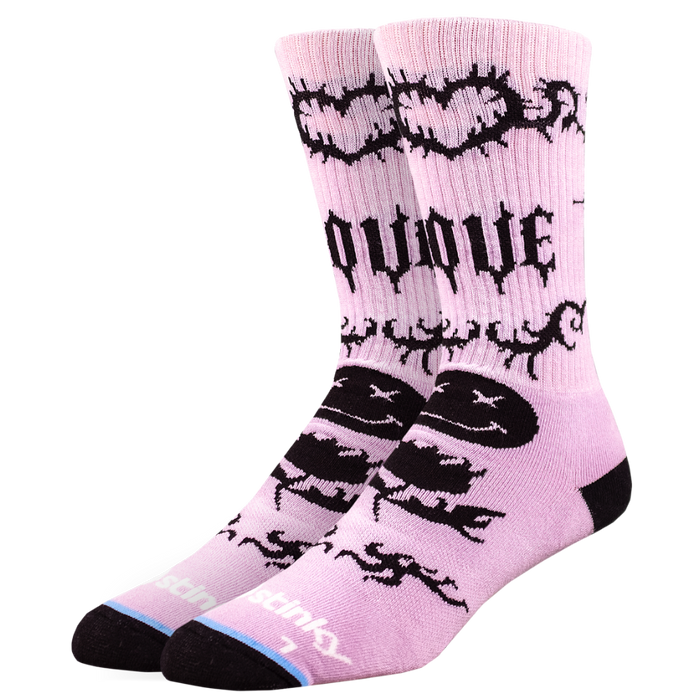 Pink socks with black designs and text on a white background