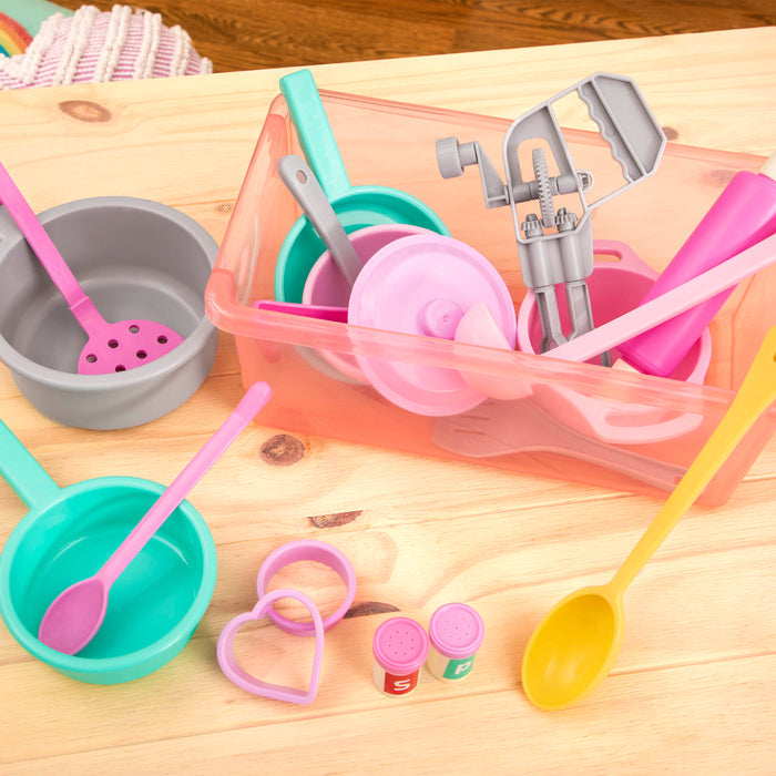 A colorful set of kitchen toys with a bin to store verything in.