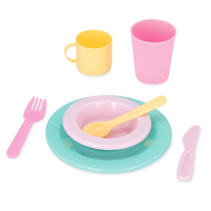 A set of toy dishes including a tea pot.