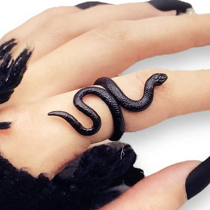 woman wearing index finger Edgy Black Coiled Snake Ring with textured serpent wrap design