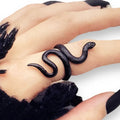 woman wearing index finger Edgy Black Coiled Snake Ring with textured serpent wrap design