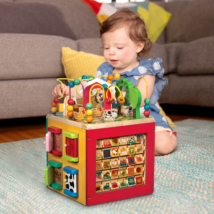 Farm animal activity center with a bead maze on top.