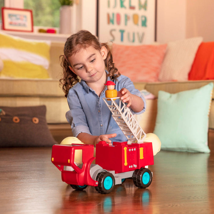 A red toy fire truck.