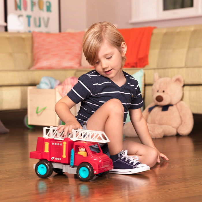 A red toy fire truck.