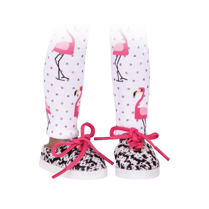 Flamingo-printed leggings and black & white patterned shoes