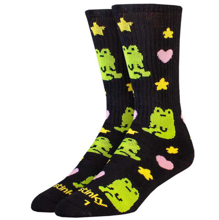 Pair of socks with green frog designs on a black background
