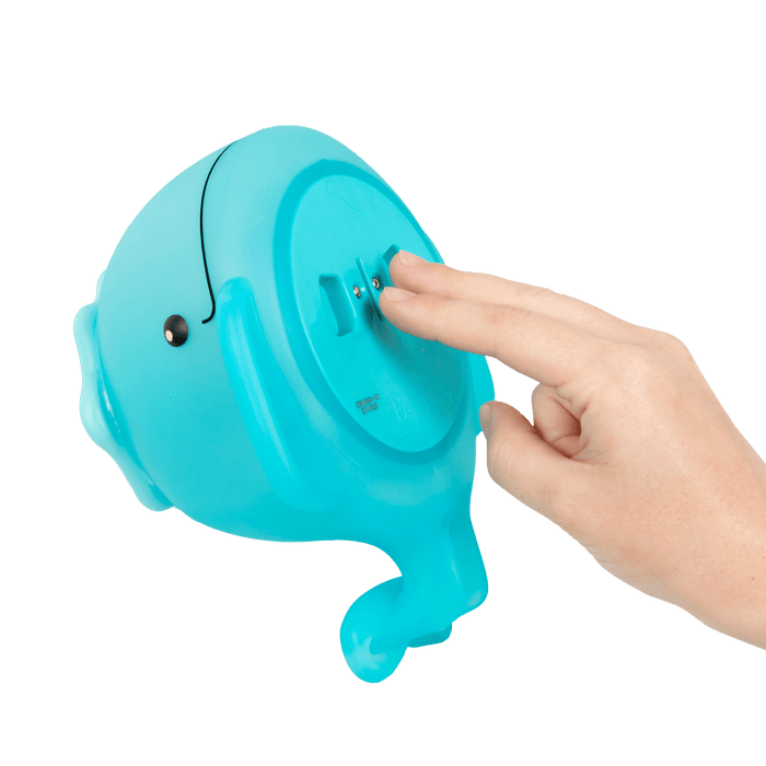 Frog squirt and light-up whale bath toys.