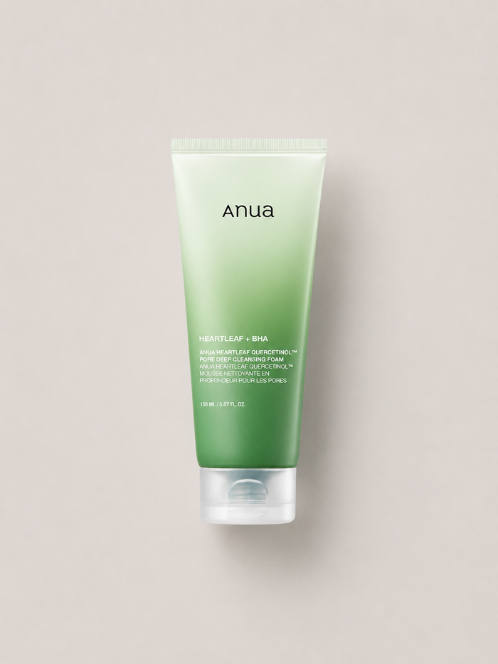 Korean Skincare - Anua Quercetinol Pore deep Cleansing Foam heartleaf + BHA gentle cleansing foam in a light green to dark green gradient squeeze tube with a clear cap, centered on a light greige background. 150 ml.