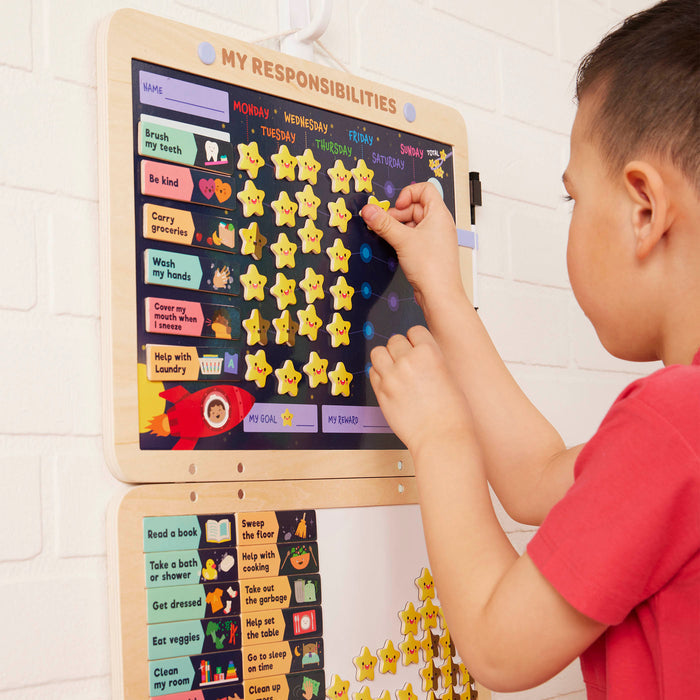 Space-themed responsibility chart with magnets, booklet, and dry-erase marker.