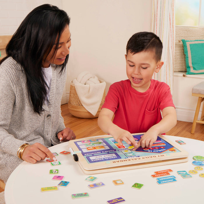 Calendar for kids with magnets, booklet, and dry-erase marker.