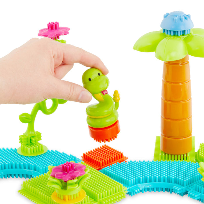 A vehicle and structure made with Bristle Blocks.