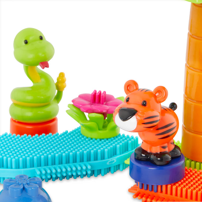 A vehicle and structure made with Bristle Blocks.