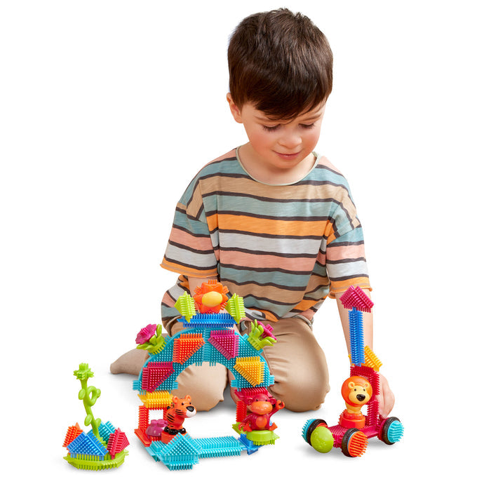 Creations made with Bristle Blocks, including a car with functional wheels.