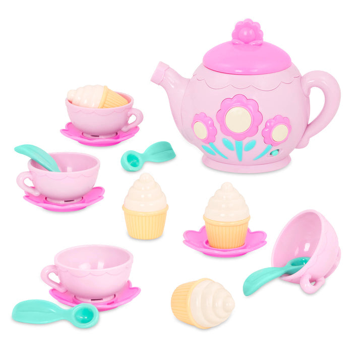 A toy tea set with toy cupcakes.