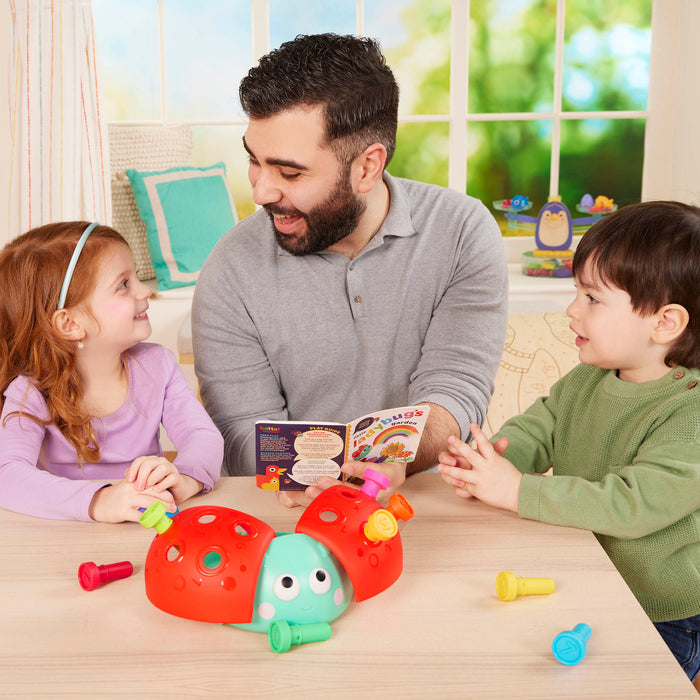 Colorful ladybug peg toy with booklet.