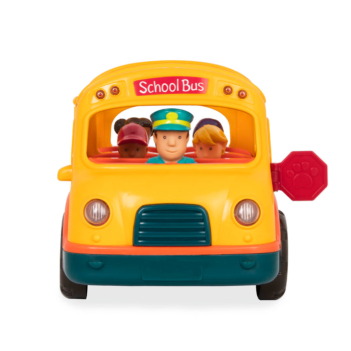 A yellow school bus toy for kids with the door folded down so 2 figurines can get on the bus.