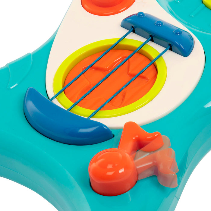 Toy guitar, with a blue body and green and orange buttons.