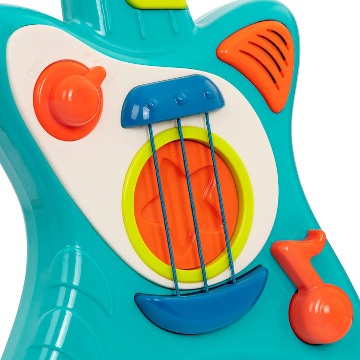 Toy guitar, with a blue body and green and orange buttons.