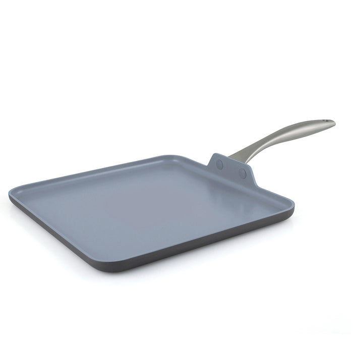 Square gray ceramic griddle with a curved metal handle on a white background.