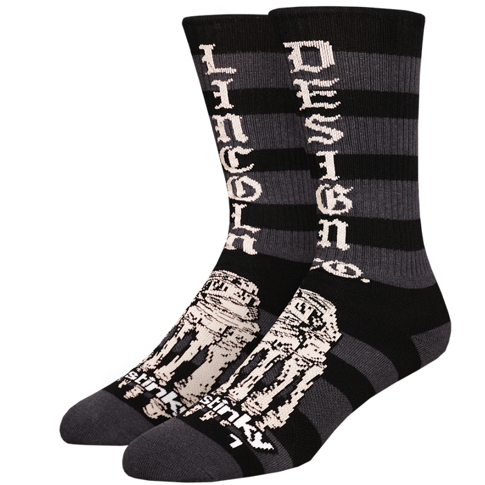Black and gray striped socks with white text and design on a white background