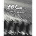 This image features the cover of the book "Mario Giacomelli: Figure/Ground" curated by Virginia Heckert. The cover showcases a monochrome photograph of what appears to be dynamic, blurred light trails, possibly on water, capturing the essence of Giacomelli's bold, geometric compositions with glowing whites and deep blacks.