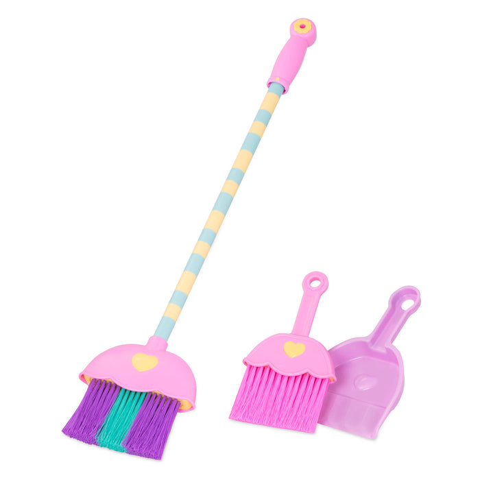 A toy broom, brush, and dustpan.