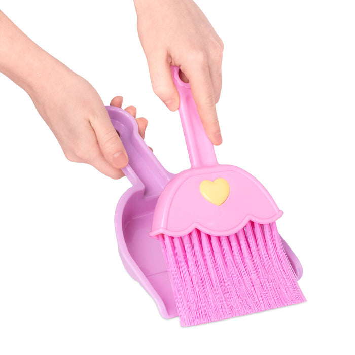 A toy broom, brush, and dustpan.