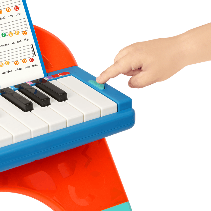 Toy piano and songsheet
