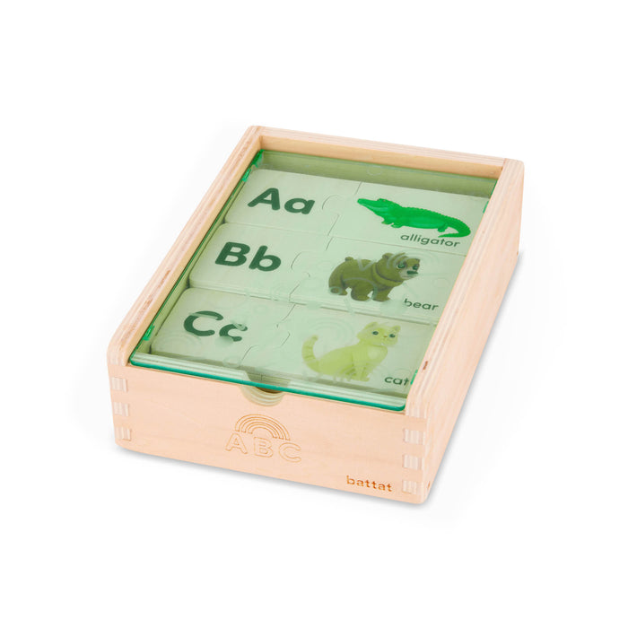 Puzzle pieces in a wooden box.