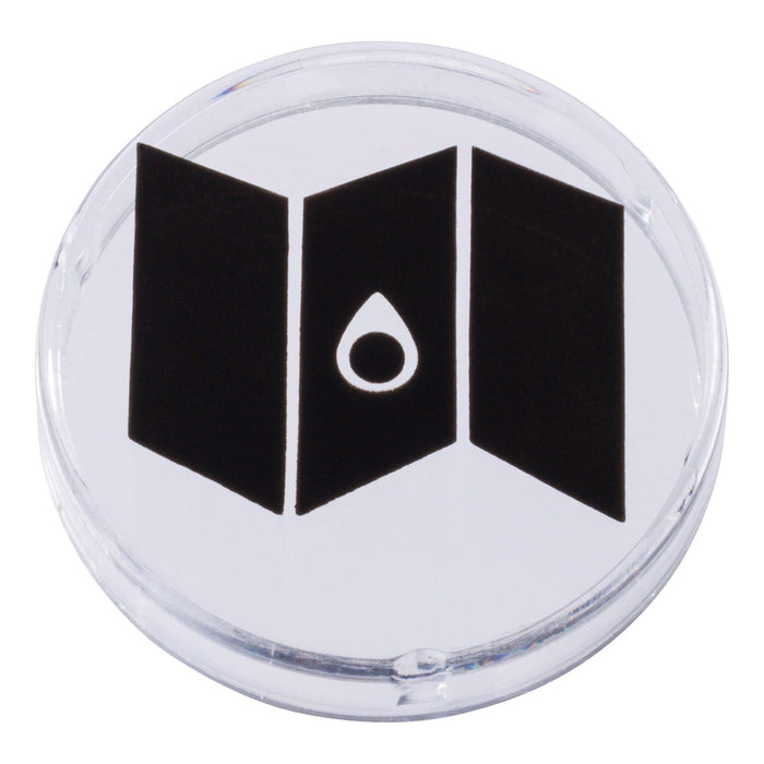 A clear round token with a black map and water droplet icon, designed for imaginative play in kids' tents or paired with the Outdoor Discovery Wildlife Tent Projector by Outdoor Discovery.