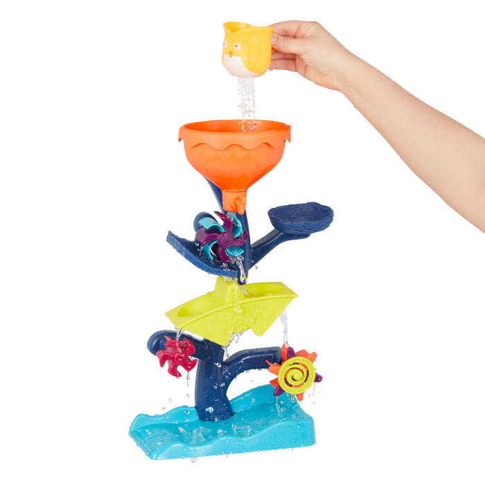 Water wheel toy with owl and truck.