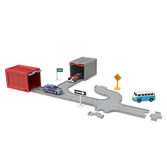 Surprise container with toy vehicles surrounding it.