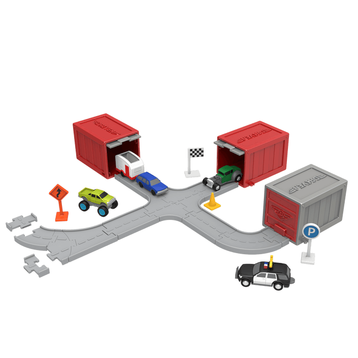 Surprise container with toy vehicles surrounding it.