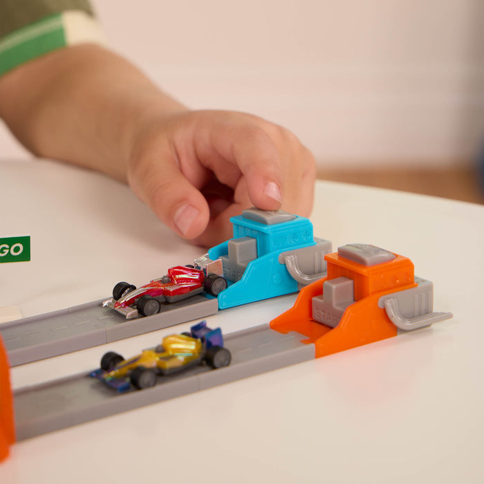 Toy car track with mini vehicles.