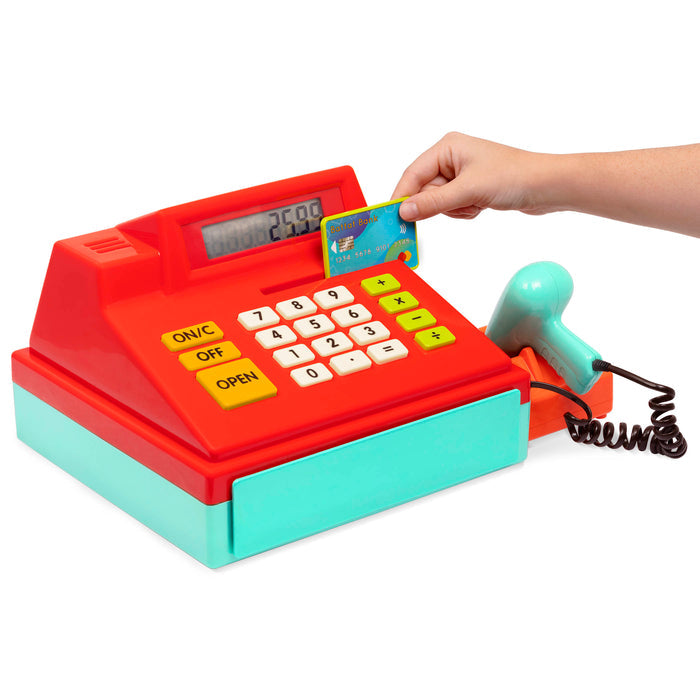 Toy cash register with drawer open and accessories surrounding it.