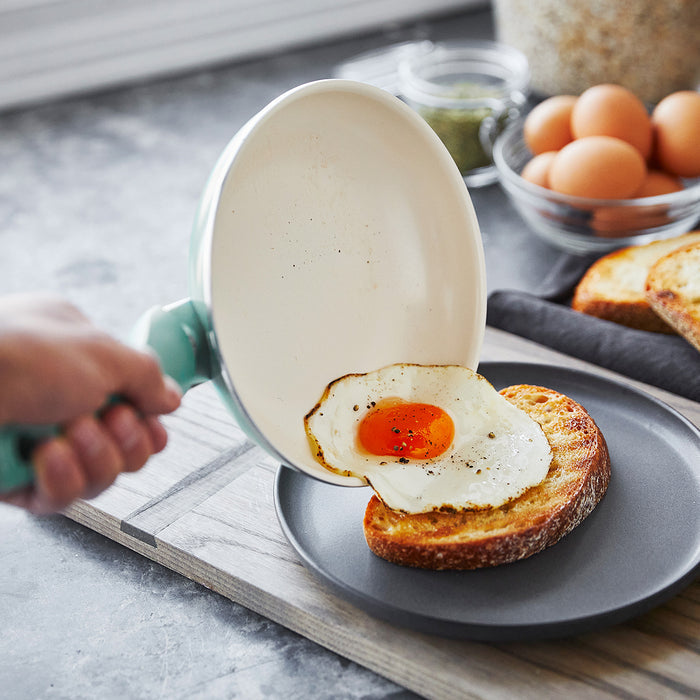 Fried egg on toasted bread, cooked in a Rio Ceramic Nonstick pan from a 16-piece cookware set.